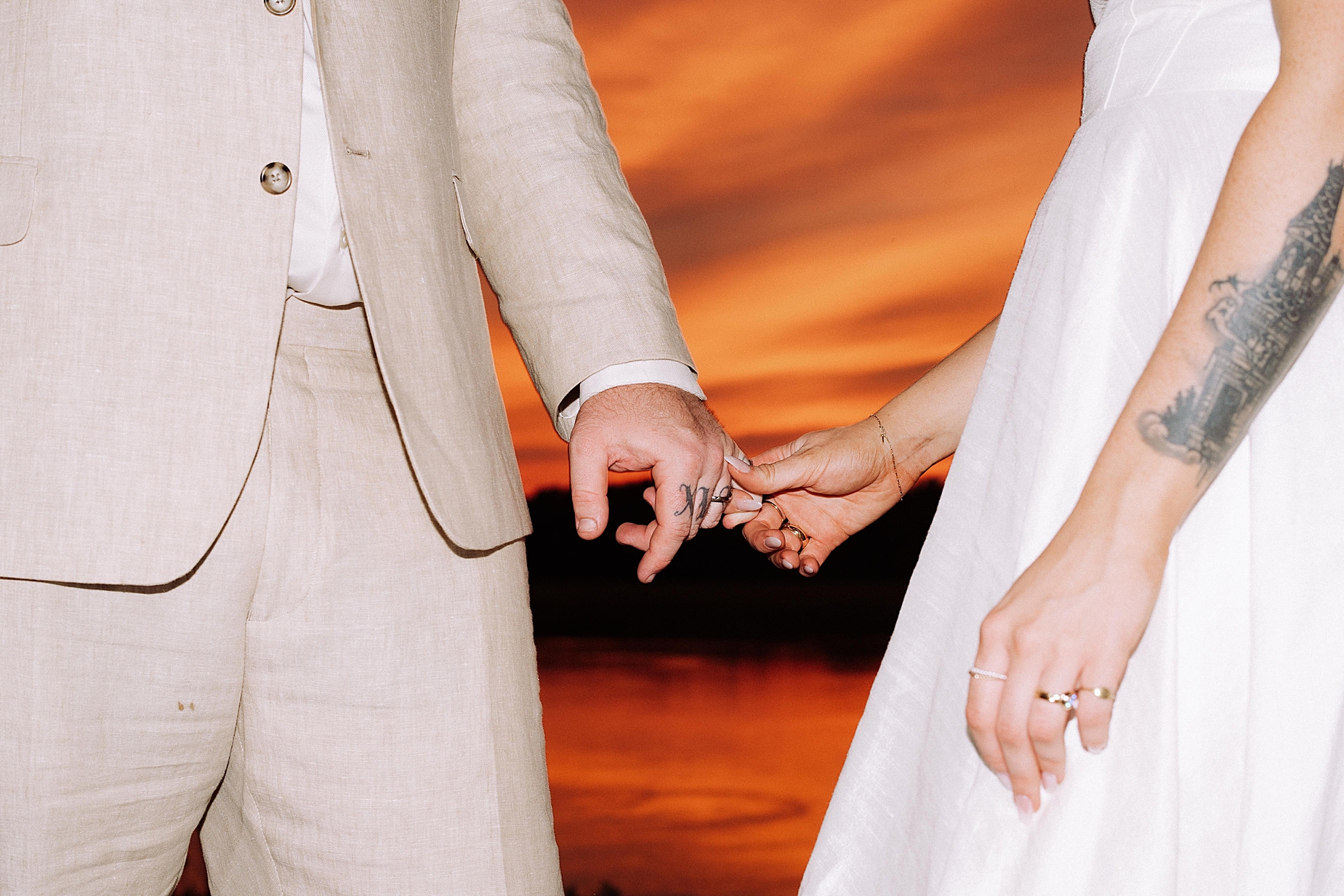 bride and groom holding hands at wedding with best wedding presets 